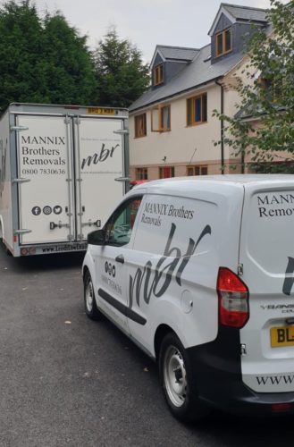 The Mannix Brothers vans outside home